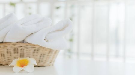 Laundry white towel with basket in bathroom with copy space.の写真素材