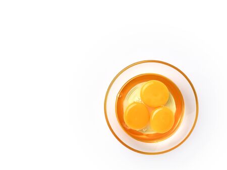 Top view and close up image of organic chicken eggs are one of the food ingredients with copy space on white background. Organic chicken eggs food ingredients concept.
の写真素材
