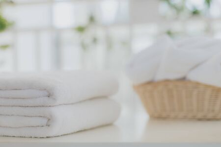 Laundry white towel with basket in bathroom with copy space.の写真素材