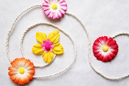 Colorful Artificial flower on mulberry paper backgroundの写真素材