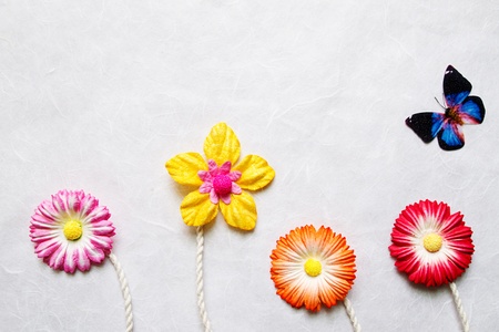 Artificial flower on mulberry paper background