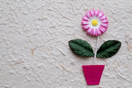 Artificial flower on mulberry  paper backgroundの写真素材