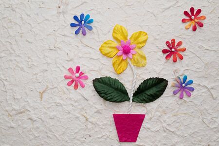 Artificial flower on mulberry  paper backgroundの写真素材
