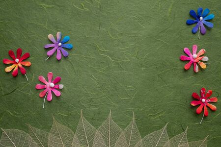 Artificial flower&leaves on mulberry  paper background
