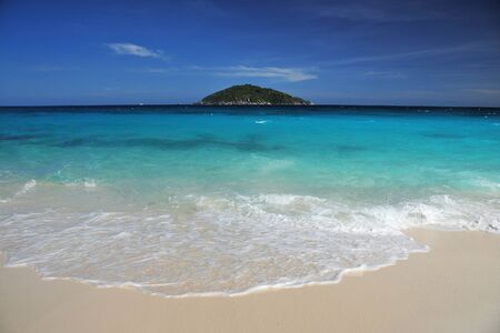 white sand beach with island in a turquoise sea, from andaman sea, thailand
