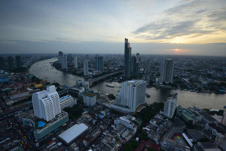 a river view of bangkok with building