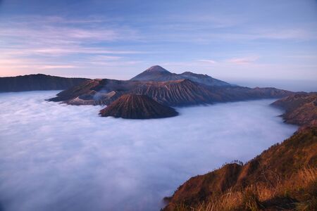 Bromo mountain with fog layer at sunrise, East Java, Indonesia