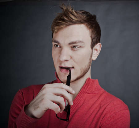 Fashion portrait of young man with glassesの写真素材