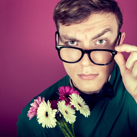 image of a man in big glasses with flowers