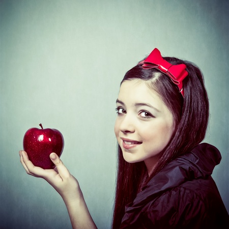Snow White with an appleの写真素材