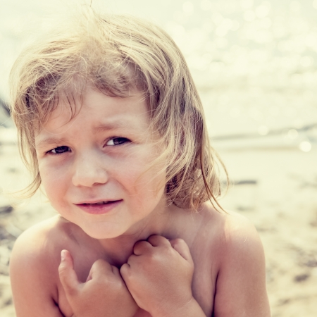 Portrait of a frightened little girlの写真素材