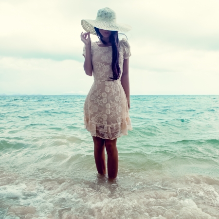 fashion portrait of a girl on the seaの写真素材