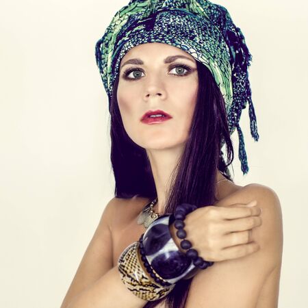 portrait of a sensual girl in a fashionable scarf