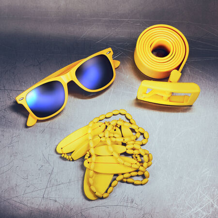 Bright yellow accessories on metal backgroundの写真素材