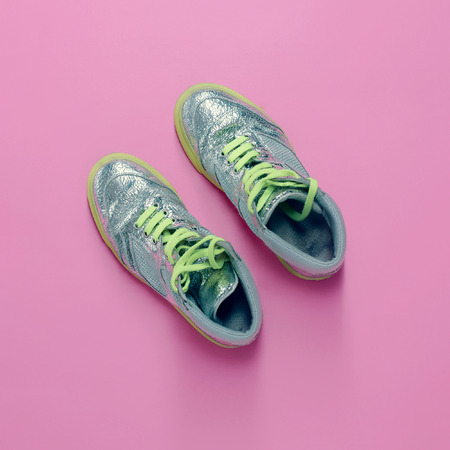 Glamorous sneakers on pink background. Vanilla fashion styleの写真素材