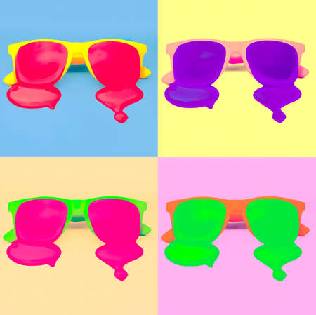 bright set hipster sunglasses on colorful background. dripping paint. explosion summer colorsの写真素材
