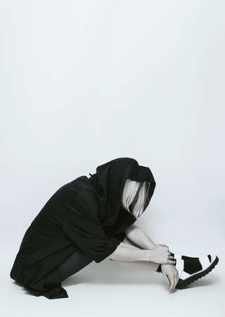 Sportswear fashion. Glamorous blonde on blue background.の写真素材