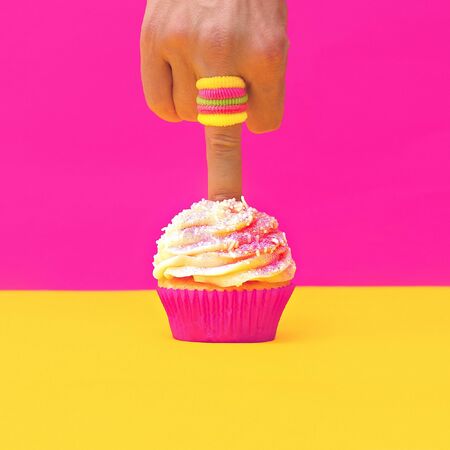 Finger pokes Vanilla Cake. Minimalism designの写真素材