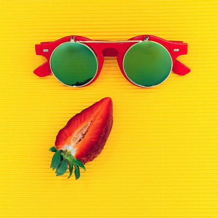 Steampunk sunglasses and strawberries. Fashion minimalism mixの写真素材