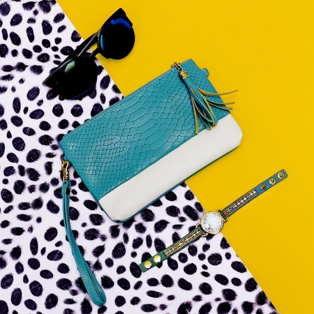 Bright stylish accessory Ladies. Clutch, sunglasses, watches. Animal print in the trend.の写真素材