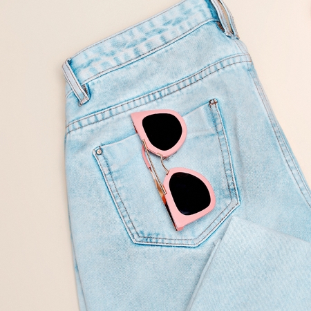 Fashion woman accessories Vanilla Lady. trendy girl. creative look. Blue denim and stylish pink sunglassesの写真素材
