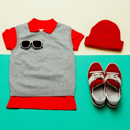 Stylish clothes. Skateboard fashion. Focus on red.