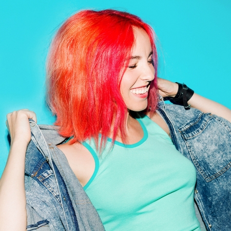 Funny Teenager girl with orange hair Stylish hair color trendの写真素材