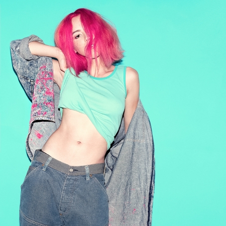 Stylish Girl with a pink hair and denim clothesの写真素材