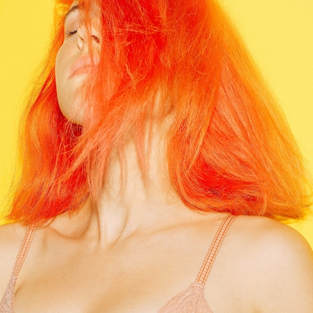 Sensual model girl with orange hair fashion, mix colors