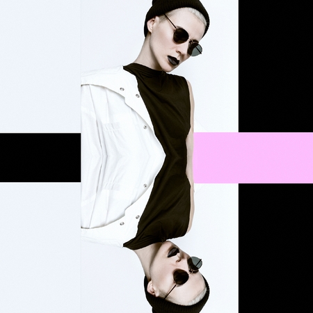 Lady hipster. Minimal. Surreal design Beanie cap and stylish sunglasses. Vintage Glamour. Trendy white coat. Outfit Black fashion stylish makeup lips Be in trendの写真素材