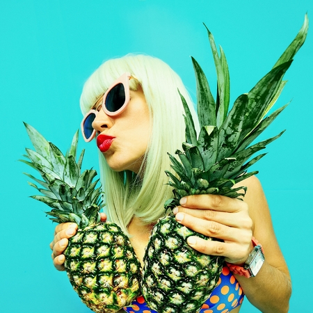 Sexy Girl with Pineapple. Hot Beach Party Styleの写真素材