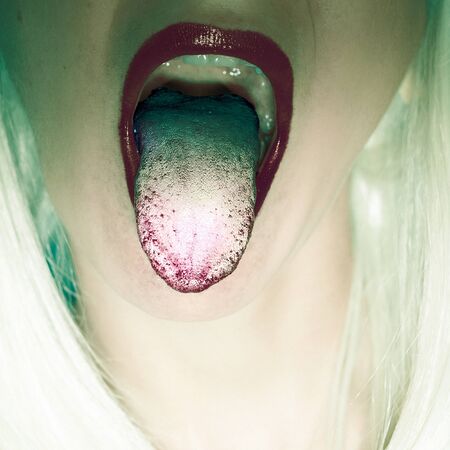 Girl with mouth open. Tongue Swag Fashionの写真素材