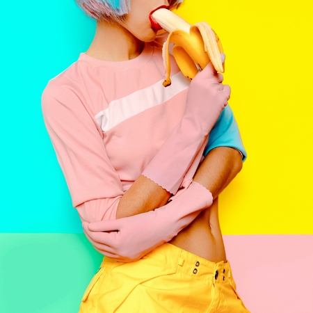 Playful Sexy model with banana Creative minimalism Sexual vibes style fashion colorの写真素材