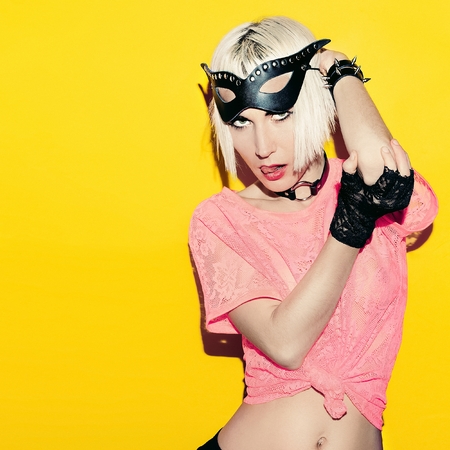 Sexy blonde in black leather fashion accessories. Time to play.の写真素材