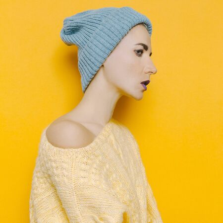 Girl in knitted sweater and knit cap. hipster styleの写真素材
