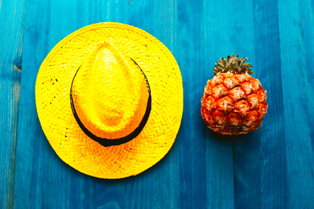 Pineapple and straw hat. Beach cocktail. Tropical Minimal. Fresh ideasの写真素材