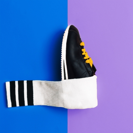 Minimal fashion creative art. Stylish sneakers and socks.