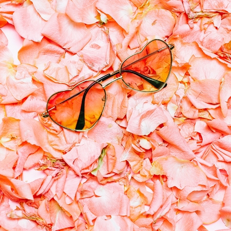 Minimal creative design. Glamorous sunglasses on flowers background. Spring is nowの写真素材