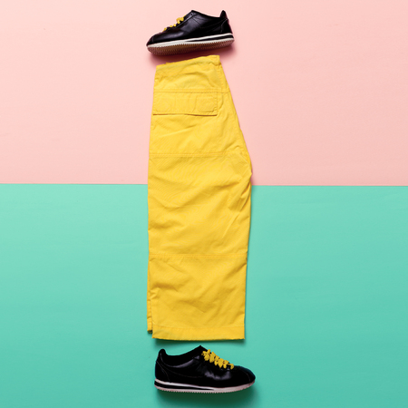 Minimal design. Pants and sneakers. Bright Summer Outfitの写真素材