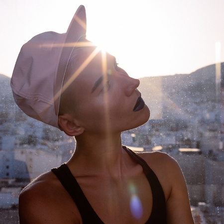 Girl in a stylish cap. Urban Tomboy style fashion vibesの写真素材