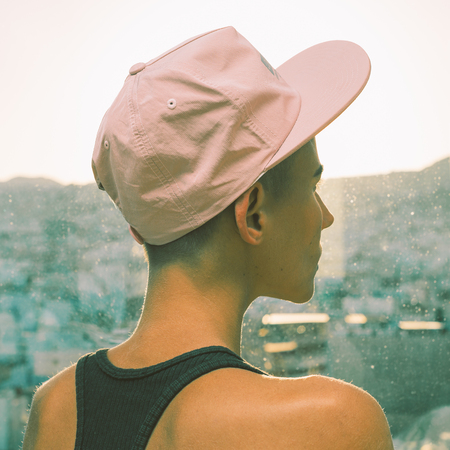 Girl in a stylish cap. Urban Street vibesの写真素材