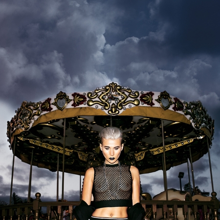 Demonic blonde in an amusement park. Swag Fashionの写真素材