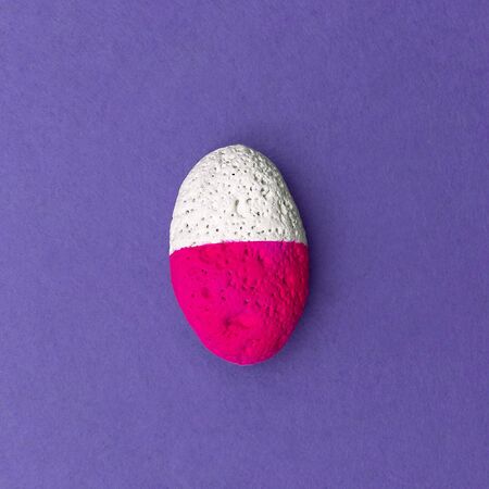 Stone in pink white paint. Minimal designの写真素材