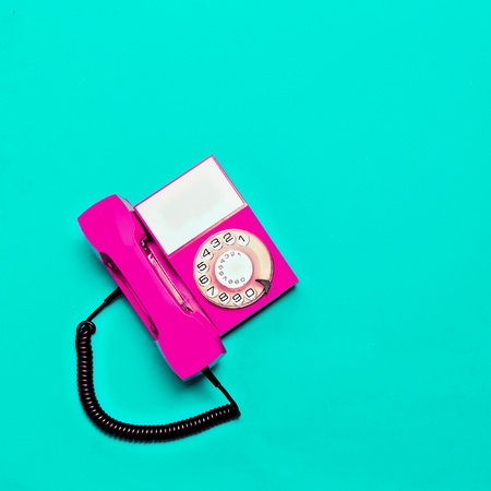Vintage pink phone. Minimal designの写真素材
