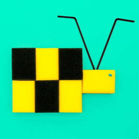 Bee from sponges and cocktail tubes. Plastic life. Minimal artの写真素材