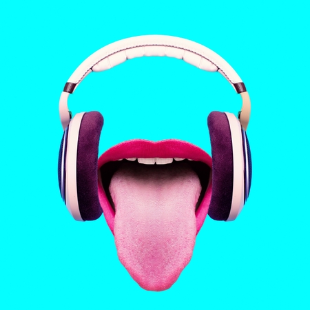 Listen to funny music. Headphones and crazy mouth. Minimal art designの写真素材