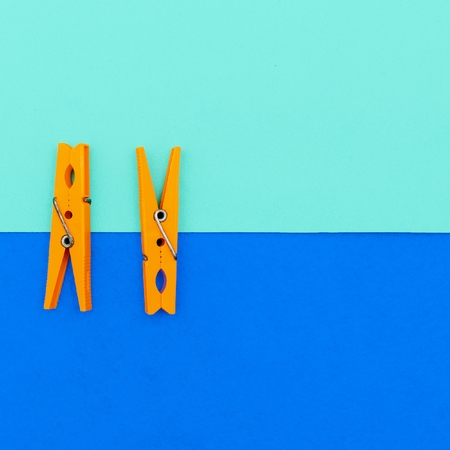 Orange clothespins.minimal art styleの写真素材