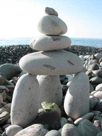 Stone ziggurat structure on the sea beachの写真素材