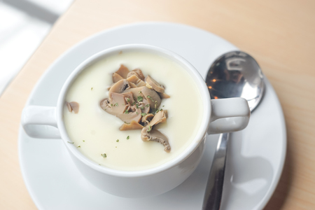 Mushroom soup on wood tableの写真素材