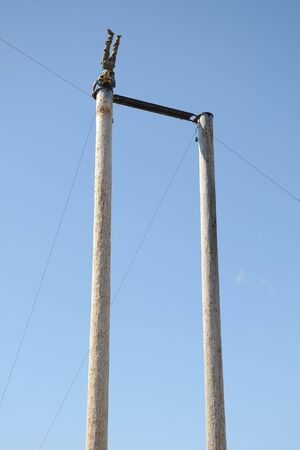 Man doing headstand on 60-foot poleの写真素材